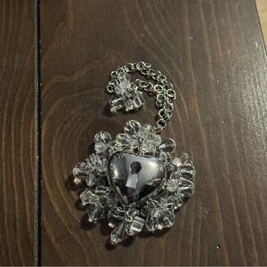 Christian Dior silver heart shaped compact on a keychain